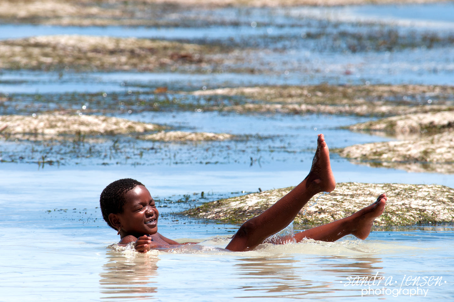 Print - Zanzibar, Tanzania - Child Playing in Water of Matemwe Beach